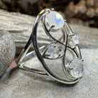Celtic Crystal Design Jewelry moonstone infinity ring with intricate Celtic pattern and sparkling moonstone gemstone.