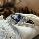Celtic Crystal Design Jewelry mystic topaz heart-shaped ring with intricate Celtic patterns on silver band.