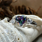 Celtic Crystal Design Jewelry Mystic Topaz Heart Ring showcasing a sparkling heart-shaped topaz gemstone on a detailed band