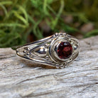 Klarina Celtic Ring by Celtic Crystal Design Jewelry featuring intricate Celtic patterns and a central amethyst gemstone.