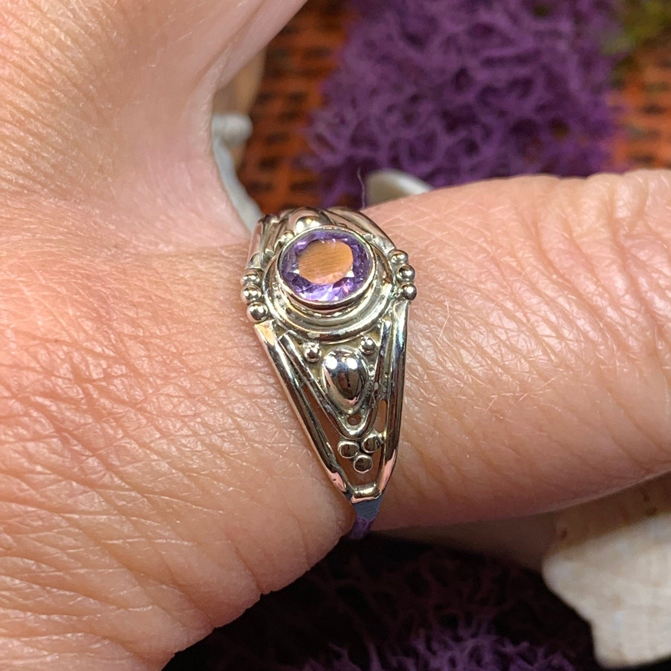 Klarina Celtic Ring by Celtic Crystal Design Jewelry featuring intricate Celtic patterns and a central amethyst gemstone.