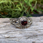Klarina Celtic Ring by Celtic Crystal Design Jewelry featuring intricate Celtic knots and a central amethyst gemstone.