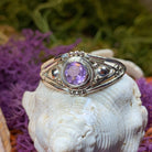 Klarina Celtic Ring by Celtic Crystal Design Jewelry featuring intricate Celtic patterns and a central amethyst gemstone.