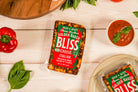 Italian Golden Baked Bliss Cheese by Cheese Brothers, Inc., showing melted baked cheese with a golden crust and creamy interior.