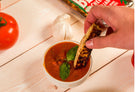 Golden baked Italian Bliss cheese from Cheese Brothers, Inc. melted and crispy with a rich, cheesy appearance.