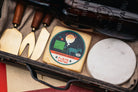 Creamy horseradish cheddar cheese from Cheese Brothers, Inc., showing a block of sharp, flavorful cheddar with horseradish pieces.