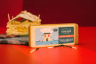 Smoked Cheddar cheese from Cheese Brothers, Inc., showing a block of savory, aged cheddar with a smoky flavor and natural rind.