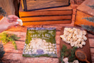 Garlic and dill cheese curds from Cheese Brothers, Inc. showcasing fresh, creamy cheese with herbs and garlic flavoring.