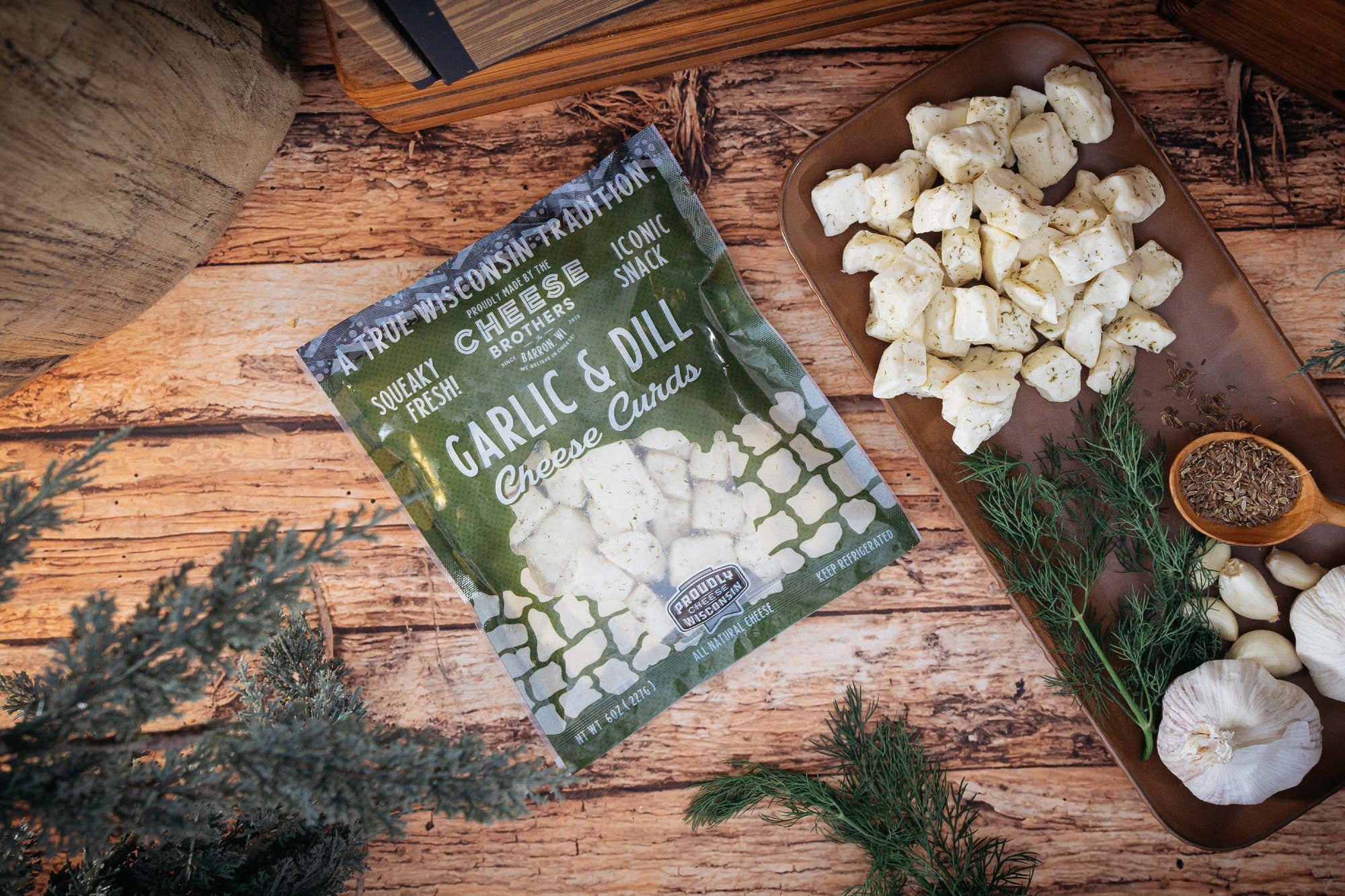 Cheese Brothers garlic and dill cheese curds in a bowl, fresh and creamy with herbs, ready to enjoy as a snack or appetizer.