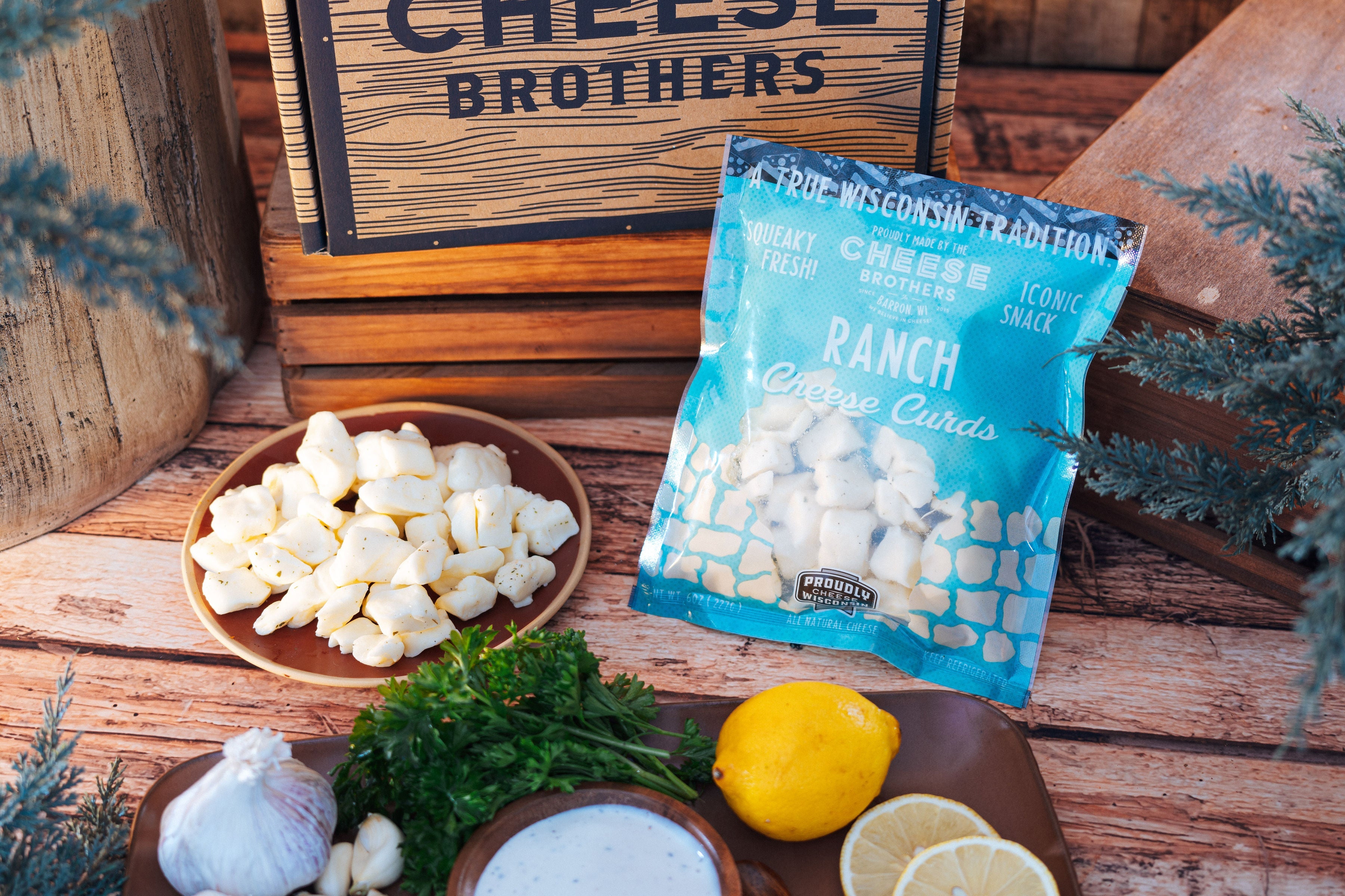 Creamy ranch-flavored cheese curds from Cheese Brothers, Inc., shown in a 6 oz portion with fresh, white cheese curds.
