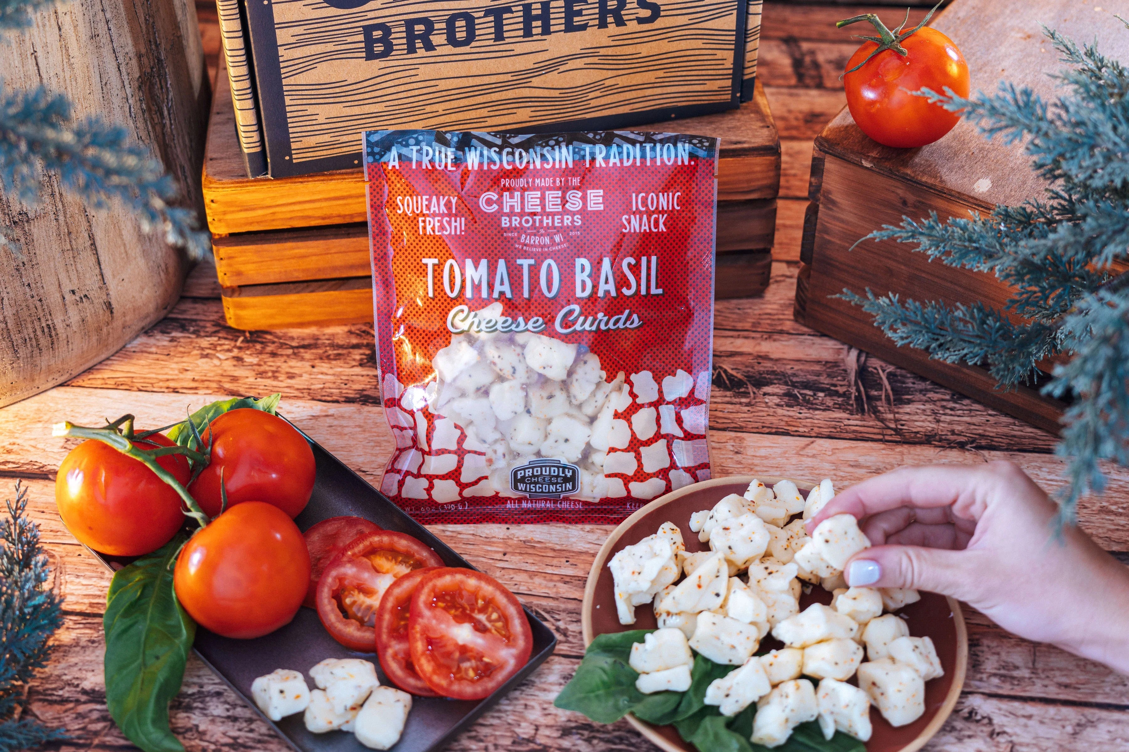 Fresh tomato basil cheese curds by Cheese Brothers, Inc. showcasing creamy cheese curds infused with tomato and basil flavors.