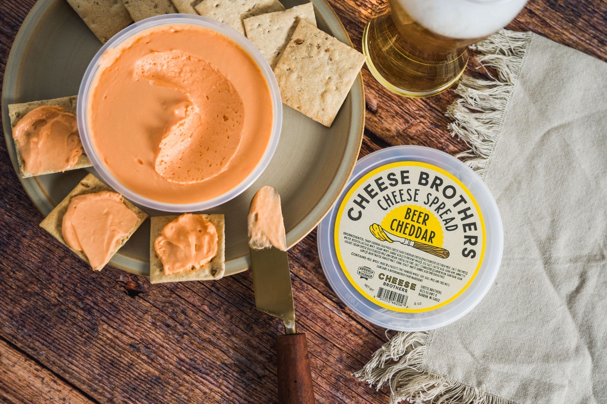 Creamy Beer Cheddar Cheese Spread by Cheese Brothers, Inc., with a smooth, textured surface and a rich cheese appearance.