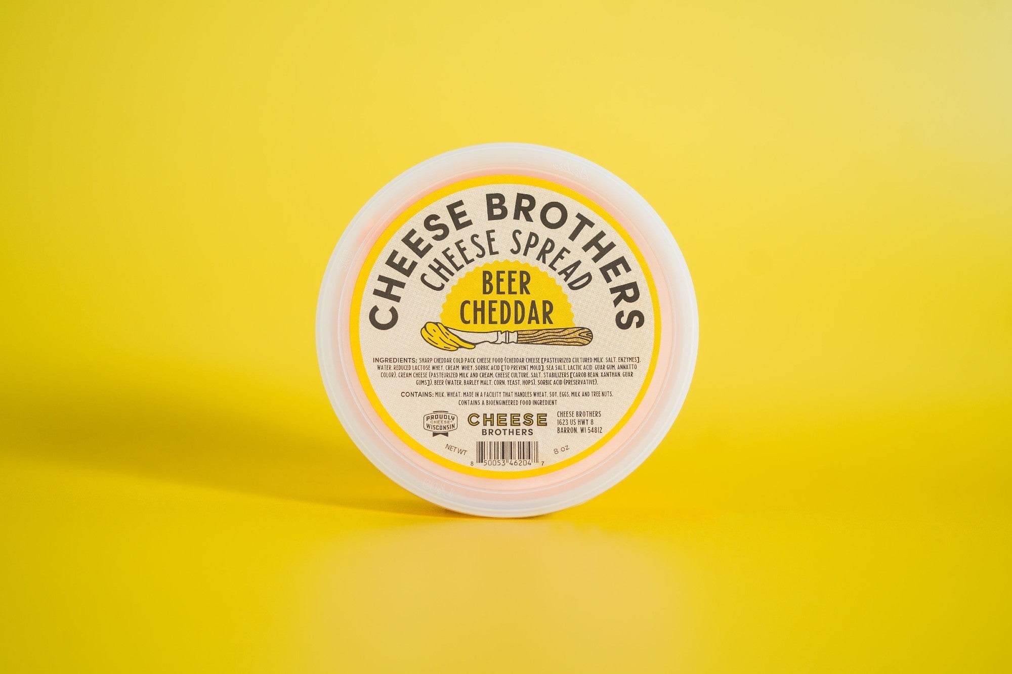 Creamy Beer Cheddar Cheese Spread by Cheese Brothers, Inc. in a bowl with a spreadable texture and rich cheddar flavor.