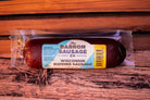 Sliced Barron Summer Sausage from Cheese Brothers, Inc., a cured meat with a rich, smoky flavor and marbled texture.