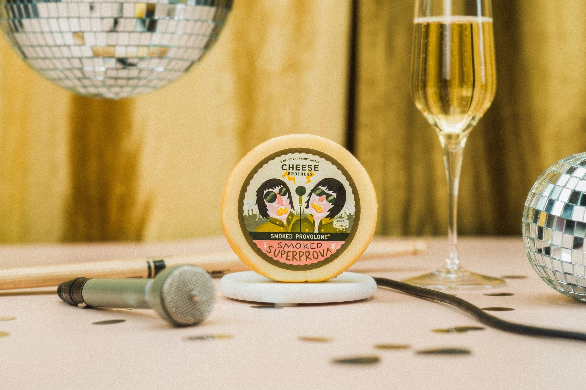 Slices of smoked provolone cheese from Cheese Brothers, Inc., showcasing its rich, smoky flavor and smooth, pale yellow texture.