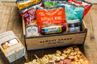 Deluxe Char-CURD-erie box from Cheese Brothers, Inc. featuring assorted cheeses, cured meats, and gourmet accompaniments.