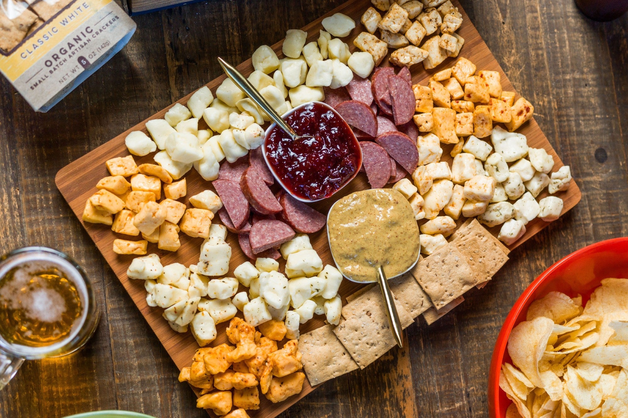 Deluxe Char-CURD-erie gift box by Cheese Brothers, Inc. featuring assorted cheeses, cured meats, and gourmet snacks.