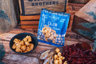 Deluxe Char-CURD-erie gift box from Cheese Brothers, Inc. featuring assorted cheeses and accompaniments in a stylish gift bundle.
