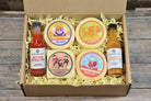 Deluxe hot and spicy gift collection by Cheese Brothers, Inc. featuring assorted spicy cheeses and gourmet snacks.