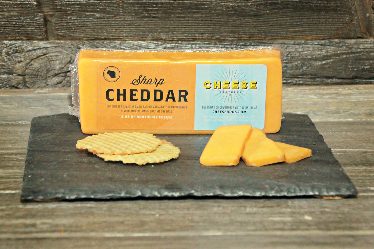 Cheese Brothers, Inc. gift basket with assorted cheeses, crackers, and snacks for a cheerful gift bundle.