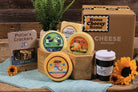 Cheese Brothers Inc. housewarming gift basket with assorted cheeses, crackers, and gourmet snacks for new homeowners
