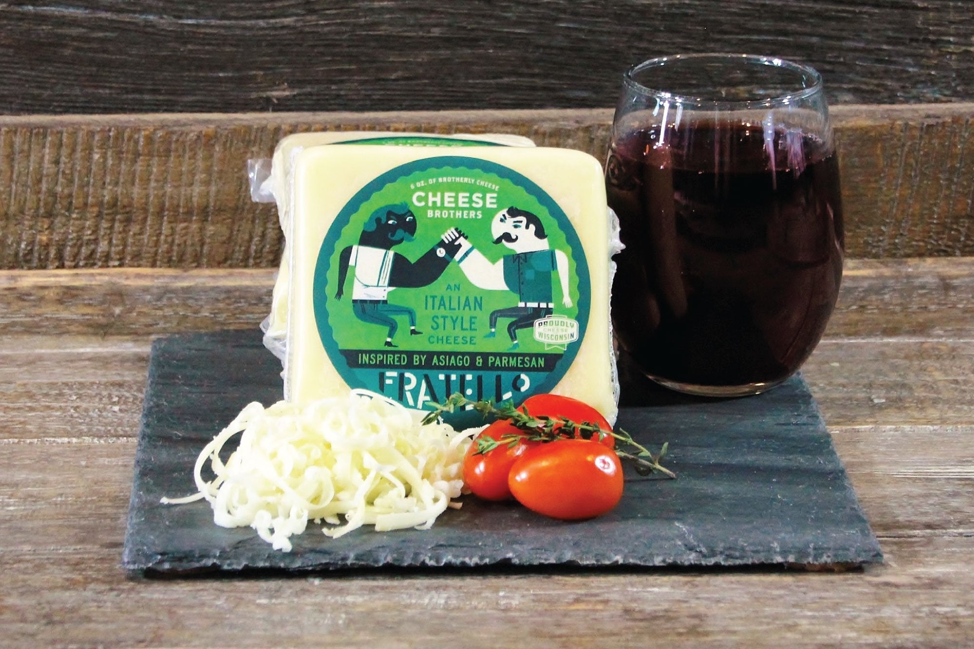 Cheese Brothers Inc. housewarming gift basket with assorted cheeses, crackers, and gourmet snacks in a stylish bundle.