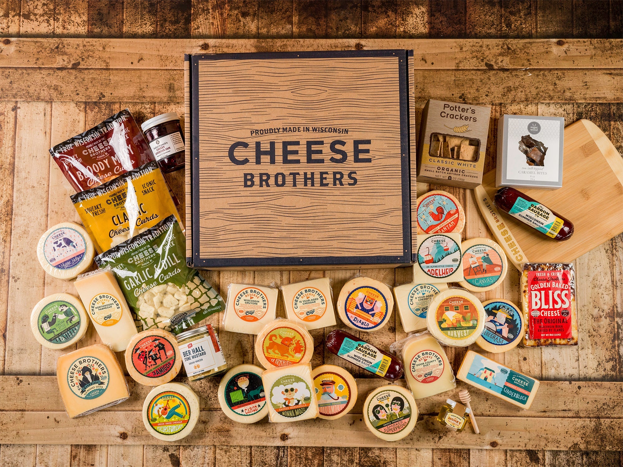 Cheese Brothers, Inc. Just About Everything Box featuring assorted cheeses, snacks, and gourmet treats in a gift bundle.