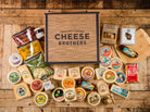 Cheese Brothers, Inc. Just About Everything Box featuring assorted cheeses, snacks, and gourmet treats in a gift bundle.