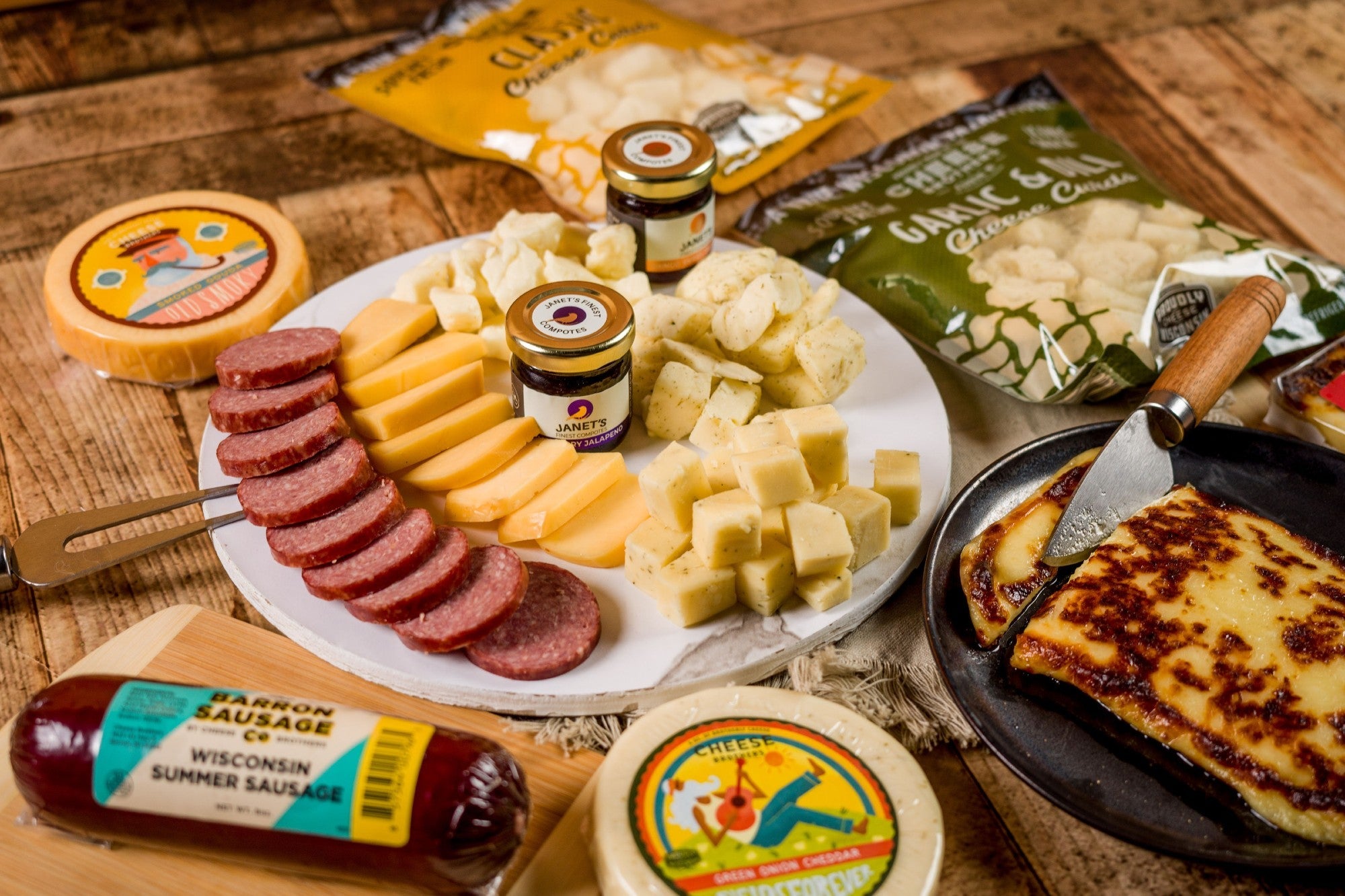 Cheese Brothers Inc. Just About Everything Gift Box with assorted cheeses, snacks, and treats in a decorative gift bundle.