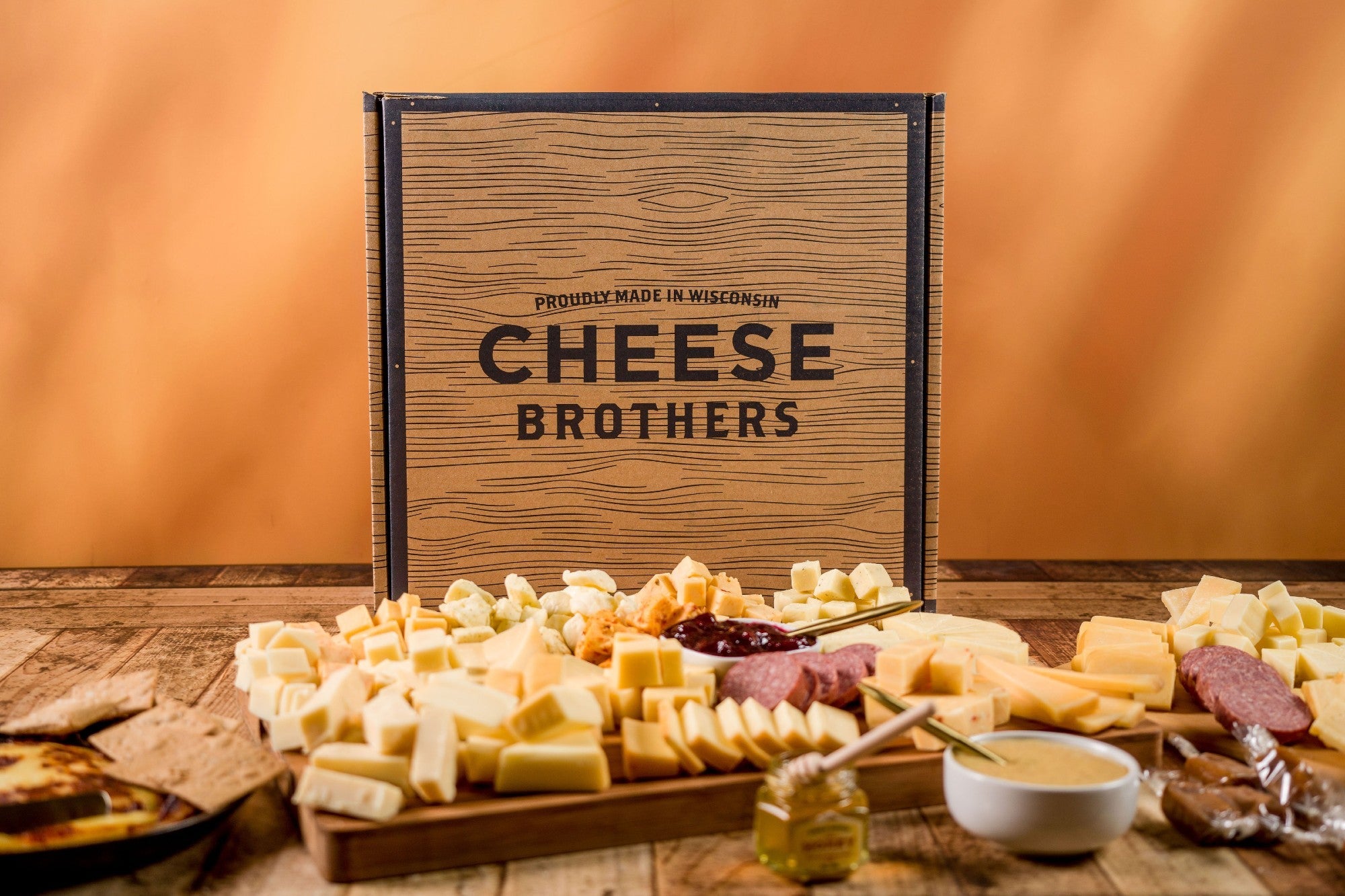 Cheese Brothers, Inc. Just About Everything Box featuring a variety of gourmet cheeses, snacks, and gift items in a colorful gift bundle.