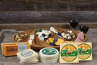 Assorted cheese box featuring 8 sharp and flavorful cheeses from Cheese Brothers, Inc., displayed in an elegant gift bundle.