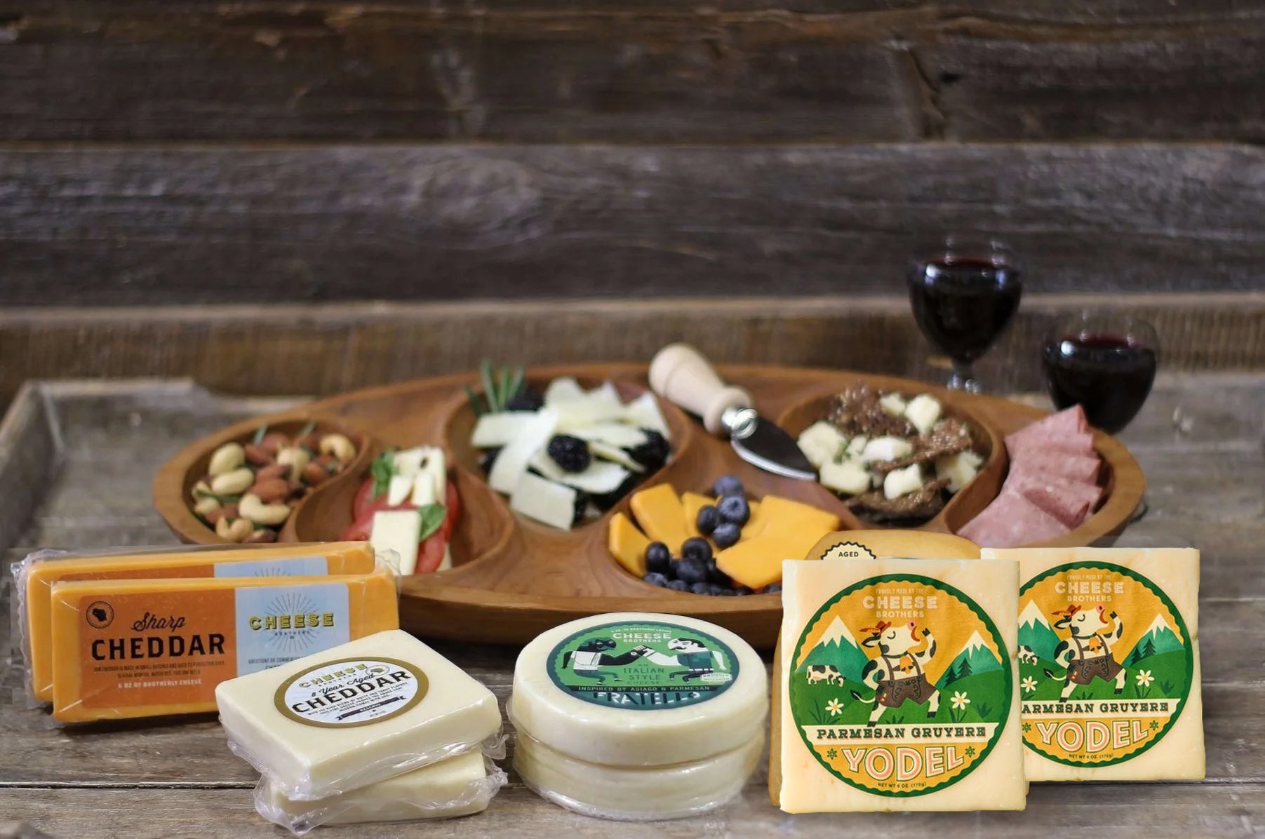 Assorted cheese box featuring 8 sharp and flavorful cheeses from Cheese Brothers, Inc., displayed in an elegant gift bundle.