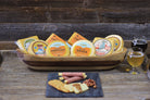 Assorted smoked cheese selection from Cheese Brothers, Inc. featuring 8 different cheeses in the Smoked Favorites Pack.