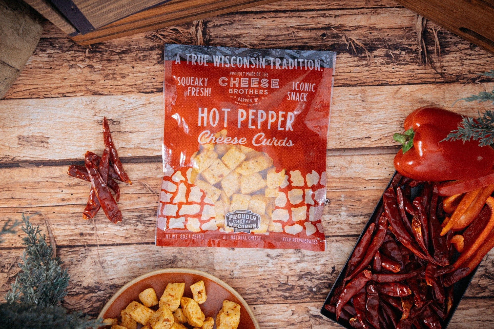 Spicy hot peppers in a gift box from Cheese Brothers, Inc. Char-CURD-erie Box, featuring fresh, colorful peppers for gift bundles.