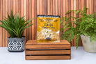 Assorted Wisconsin Cheese Curds Sampler 8-Pack from Cheese Brothers, Inc., showing fresh, golden cheese curds in a gift bundle.