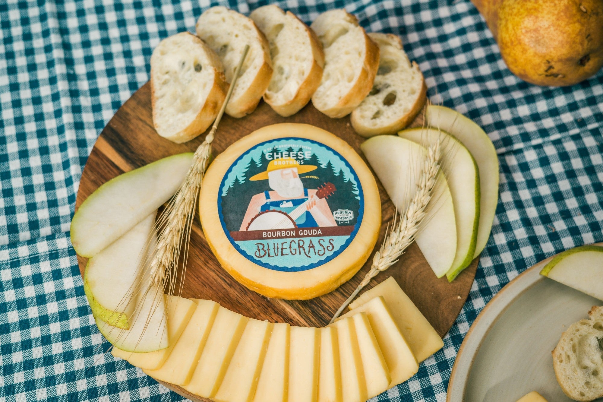Creamy Bluegrass Bourbon Gouda cheese from Cheese Brothers, Inc., featuring a rich, smooth texture with a bourbon-infused flavor.