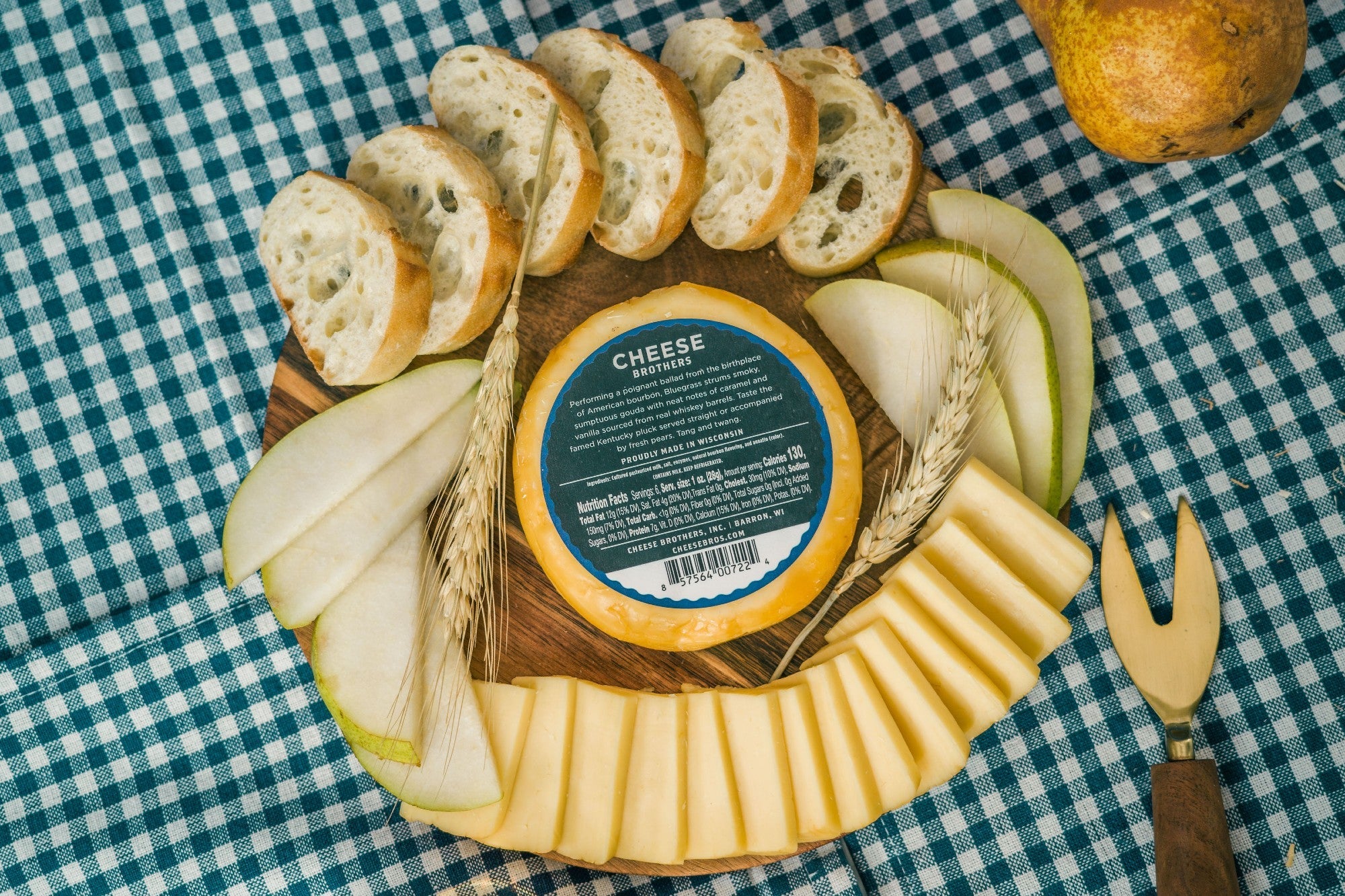 Creamy Bluegrass Bourbon Gouda cheese from Cheese Brothers, Inc., showcasing a wedge of rich, blue-hued gouda with bourbon infusion.