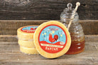 Slices of Honey Sriracha Gouda cheese from Cheese Brothers, Inc., showing creamy texture with swirls of honey and sriracha sauce.