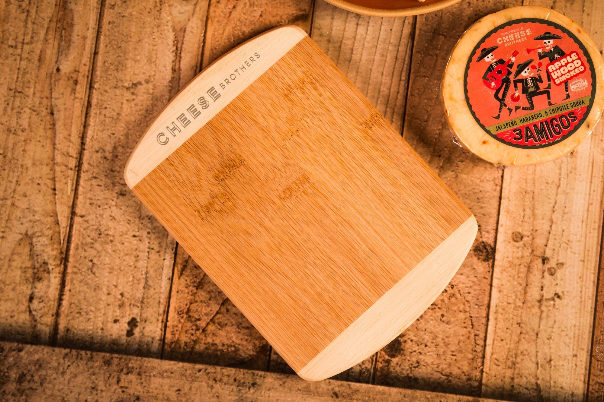 8-inch Cheese Brothers cutting board made of durable wood, perfect for cheese serving and food preparation.