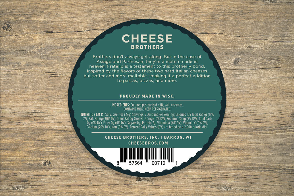 Slices of Fratello original cheese from Cheese Brothers, Inc., displayed on a wooden board with cheese wedges and a cheese knife.