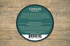 Slices of Fratello original cheese from Cheese Brothers, Inc., displayed on a wooden board with cheese wedges and a cheese knife.