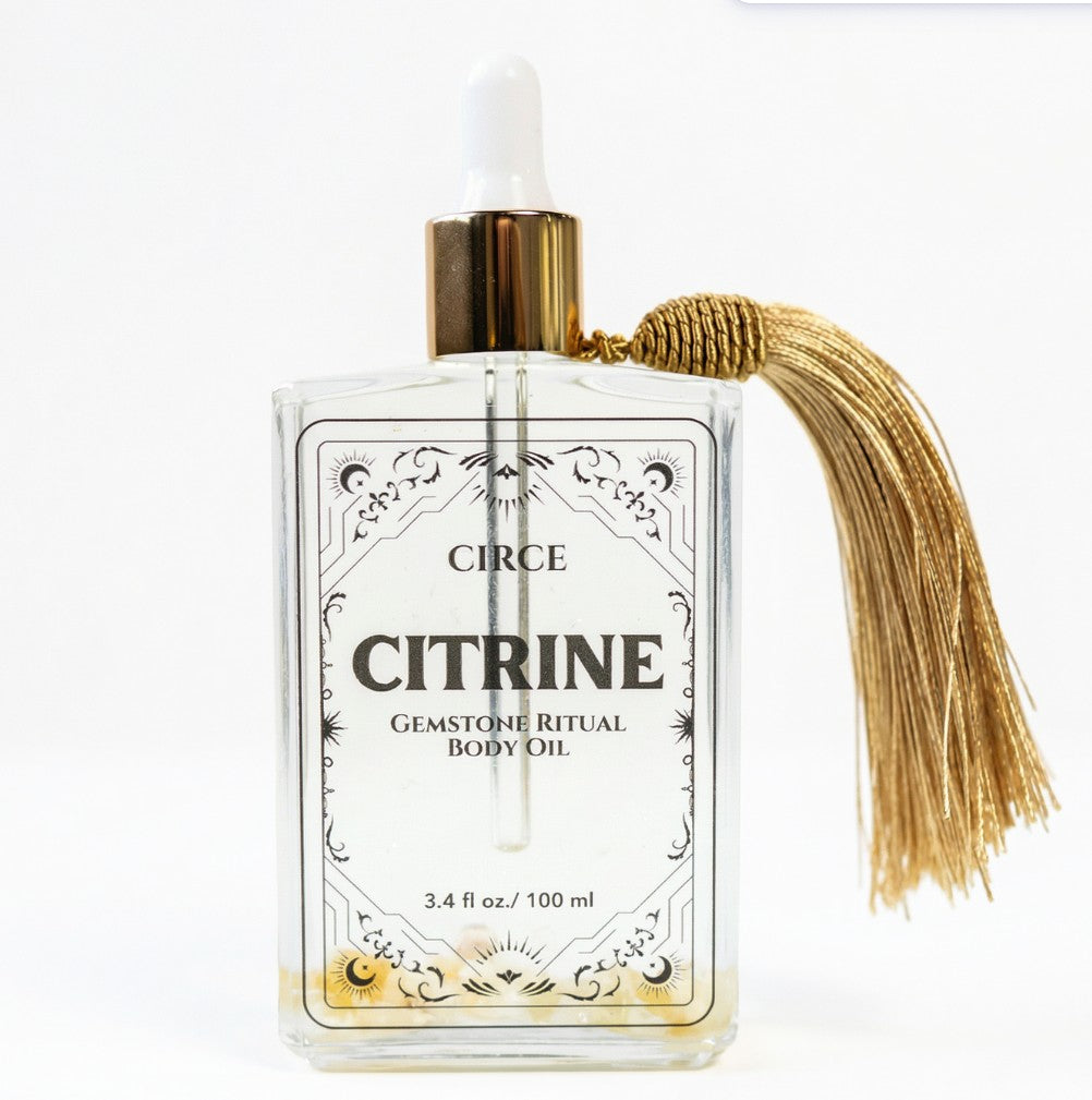 Citrine body oil bottle from Circe Boutique showing the Citrine Body Oil for abundance and crystal glow ritual.