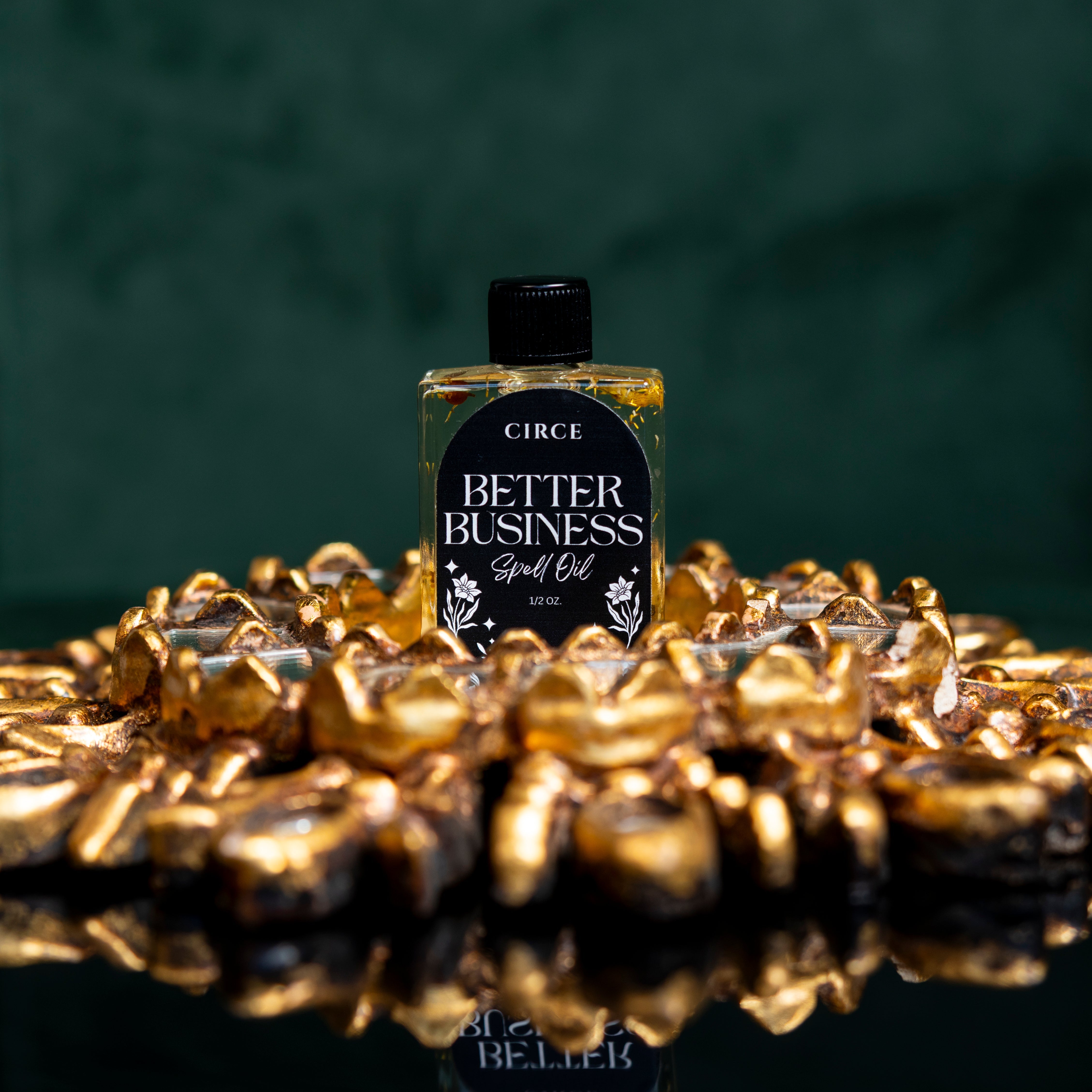 Better Business Spell Oil by Circe Boutique, success and entrepreneurial ritual oil in a glass bottle with a golden label.
