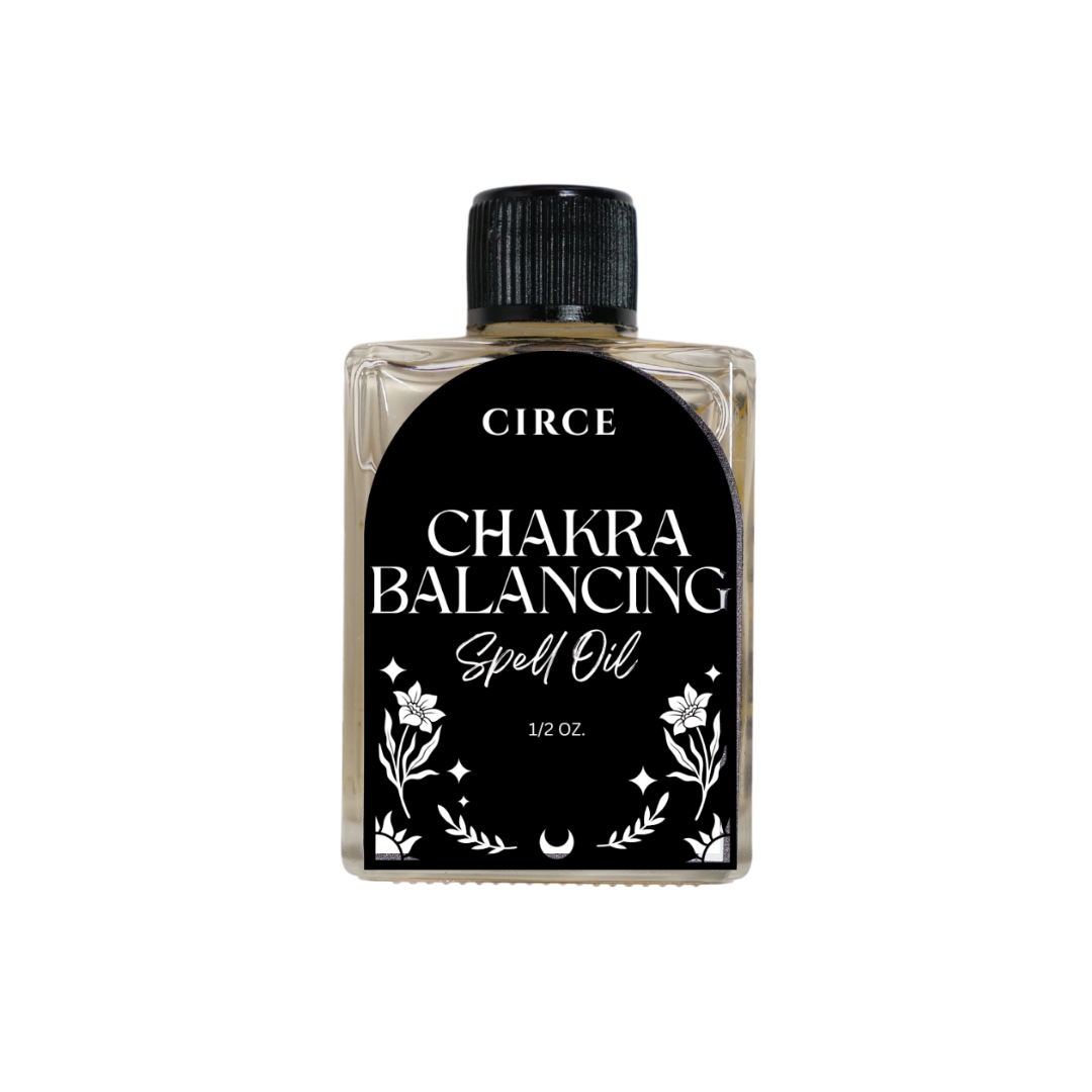 Chakra Balancing Oil from Circe Boutique with a dropper, in a glass bottle, for energy alignment and spiritual wellness.