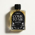 Come To Me Attraction Oil by Circe Boutique, magnetic love ritual oil in a small glass bottle with a black cap.