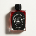 Bottle of Circe Boutique Dragon's Blood Ritual Oil for protection and power, with dark red liquid and mystical packaging.