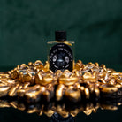 Evil Eye Protection Oil from Circe Boutique, ritual shielding anointing oil in a small glass bottle with dropper.