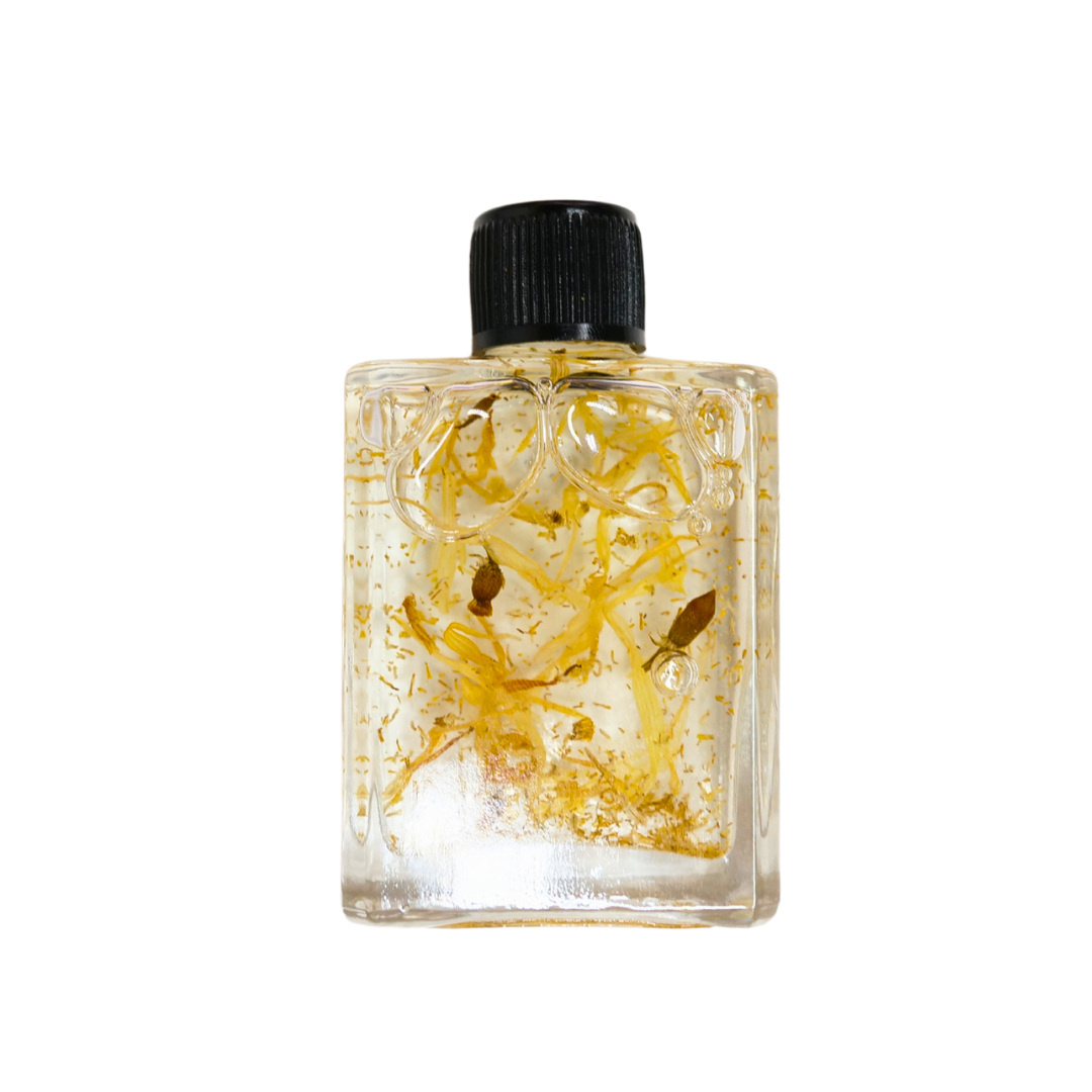 Circe Boutique Happiness Ritual Oil bottle, infused with essential oils for joy and positive energy, displayed on a wooden surface.