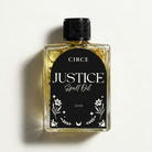 Justice Ritual Oil by Circe Boutique, featuring a small glass bottle with a golden label and a dropper for legal and fair outcome rituals.
