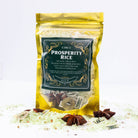 Circe Boutique Prosperity Rice 4 oz Money Altar and Mojo Bag herb in a clear bag with label and decorative accents.